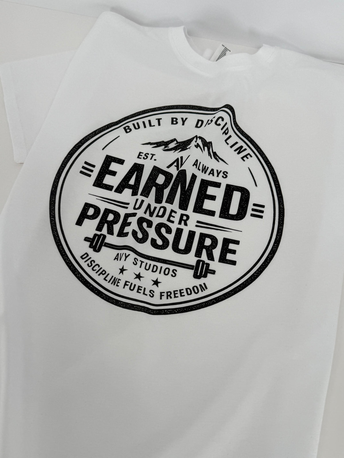Earned Under Pressure – Discipline Tee